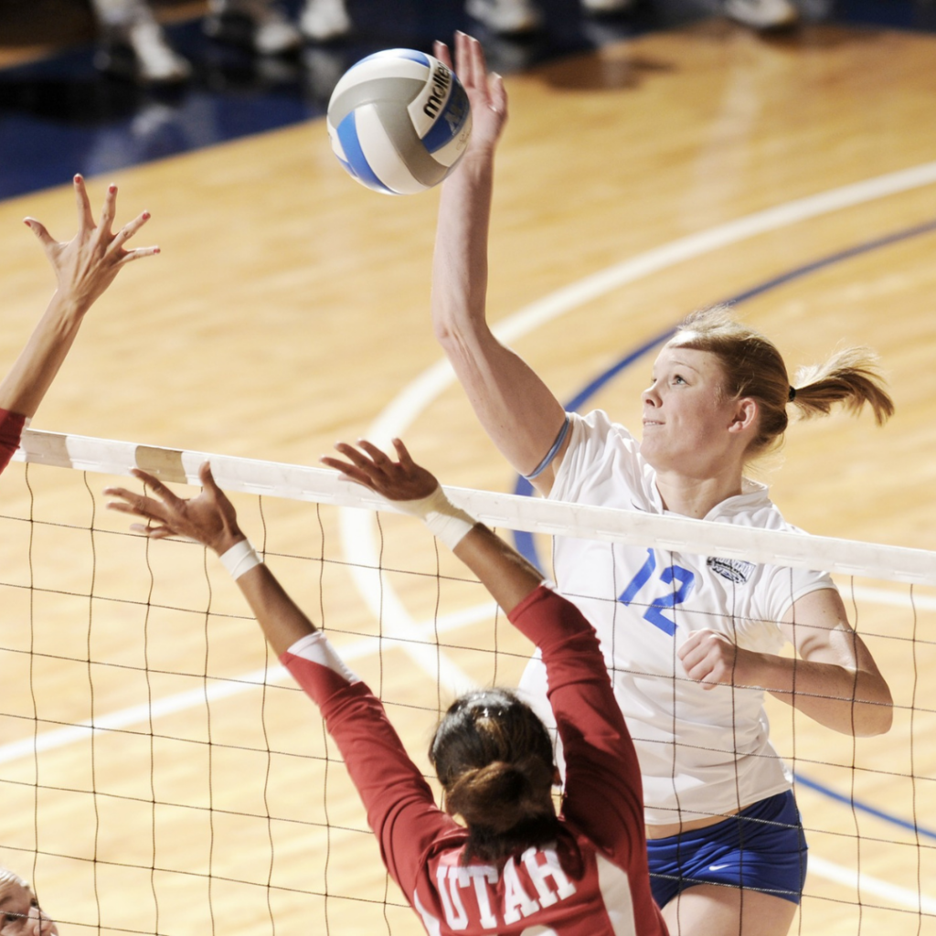 Women playing a volley ball game