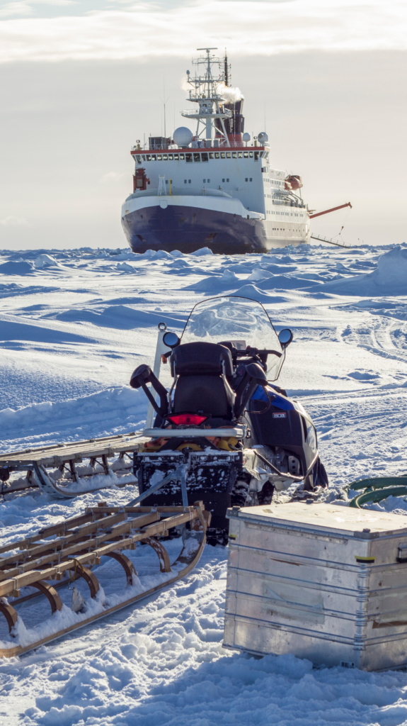 Ship in ice with snowmobile and research box